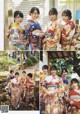 A group of women in kimonos posing for a picture.